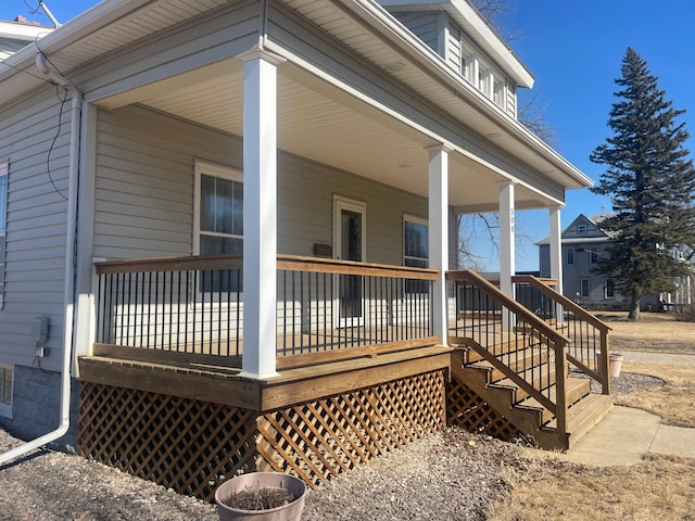 view of side of property with covered porch