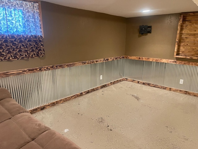 basement featuring wainscoting