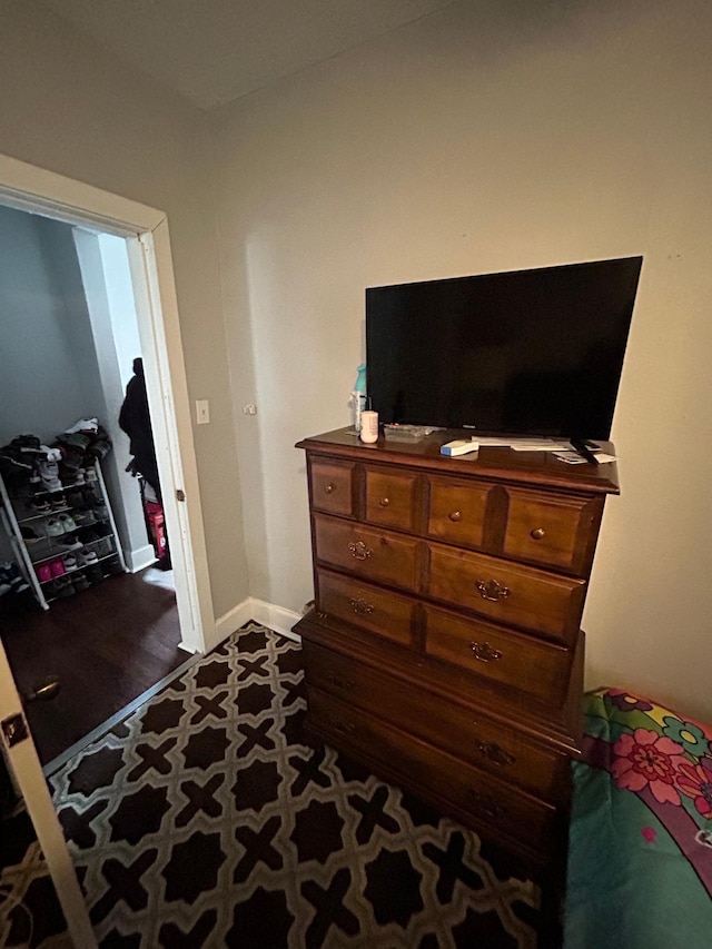 bedroom featuring baseboards