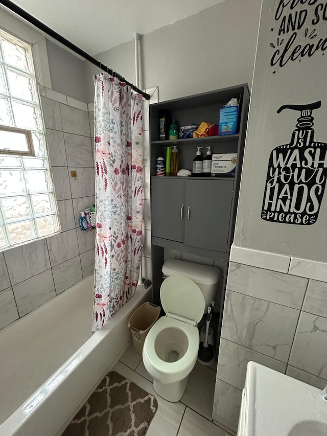 bathroom with toilet and shower / bath combination with curtain