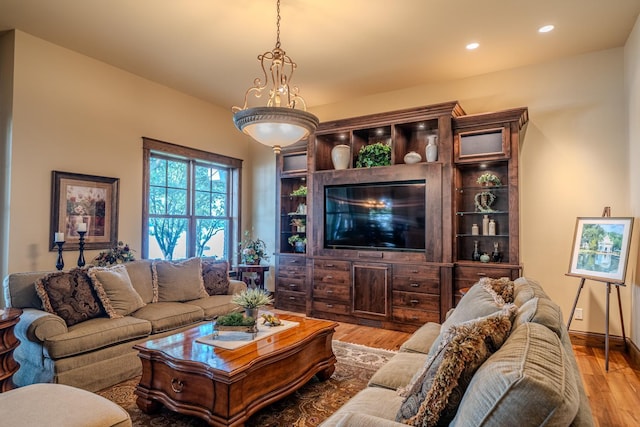 living room featuring wood finished floors and recessed lighting