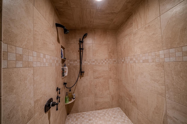 full bathroom with a tile shower
