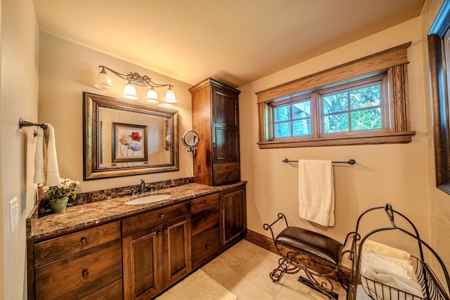 bathroom featuring vanity and baseboards