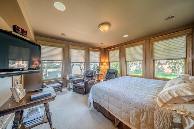 carpeted bedroom featuring visible vents and recessed lighting