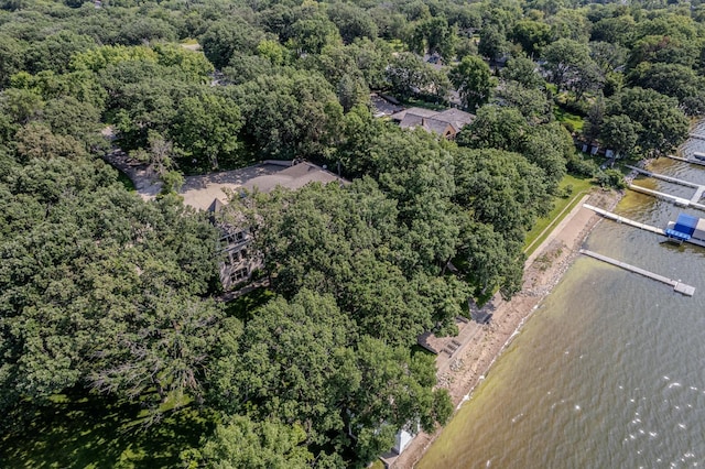 birds eye view of property featuring a water view and a forest view