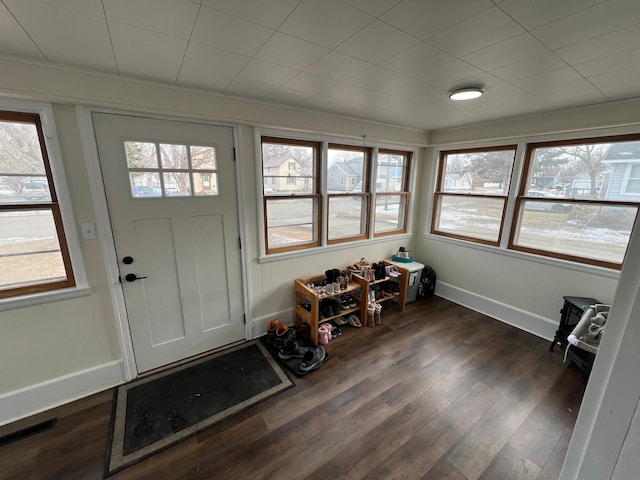 interior space featuring dark wood finished floors and baseboards