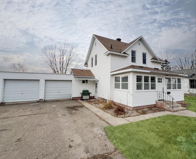 view of side of home with a lawn and entry steps