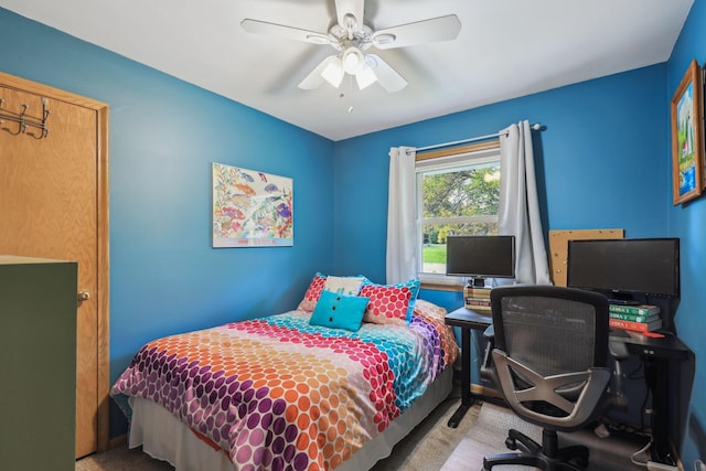 carpeted bedroom featuring ceiling fan