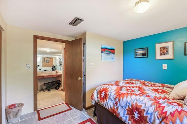 bedroom with visible vents and tile patterned floors