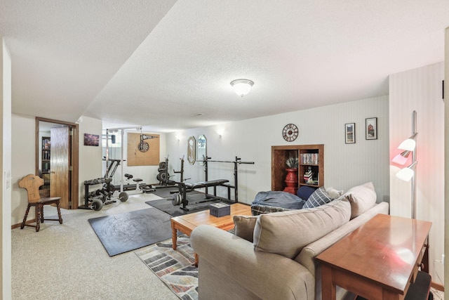 carpeted living room featuring a textured ceiling