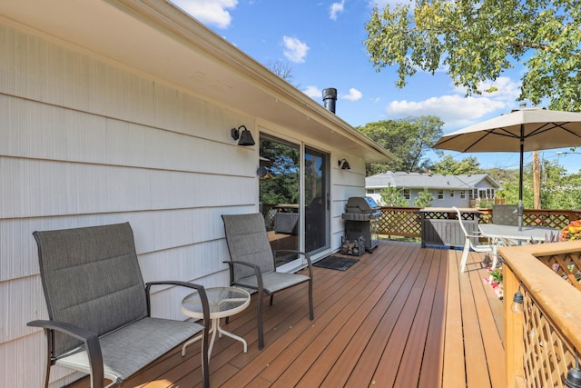 wooden deck with area for grilling