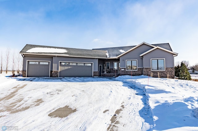 ranch-style house with a garage and brick siding