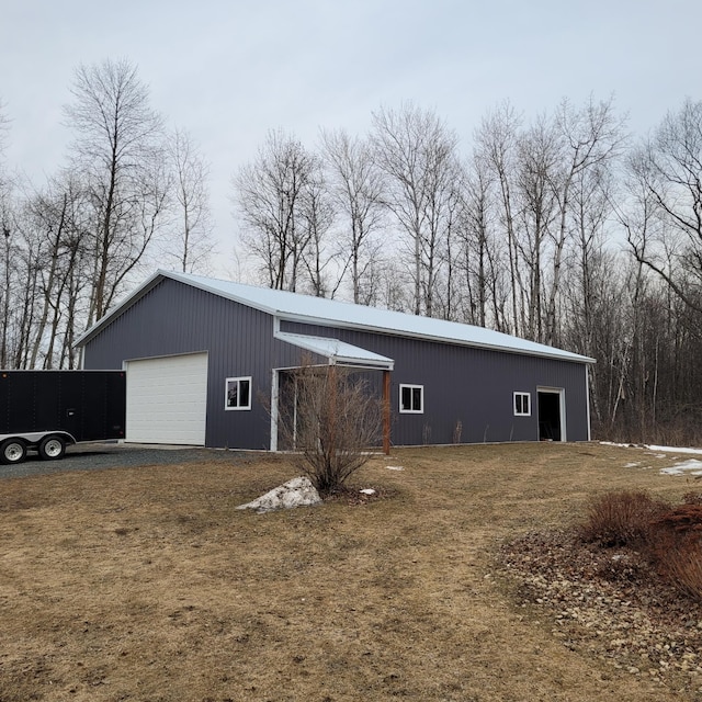 exterior space featuring an outbuilding and a detached garage