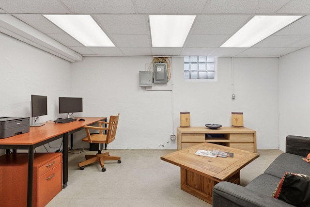 home office featuring light carpet, a paneled ceiling, and electric panel