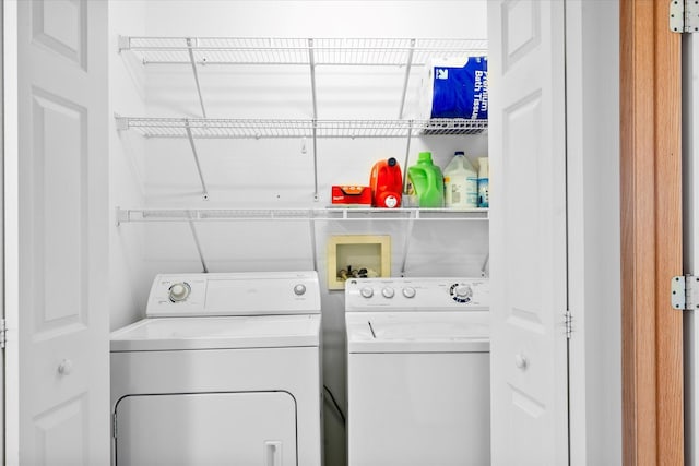 clothes washing area with laundry area and washing machine and clothes dryer