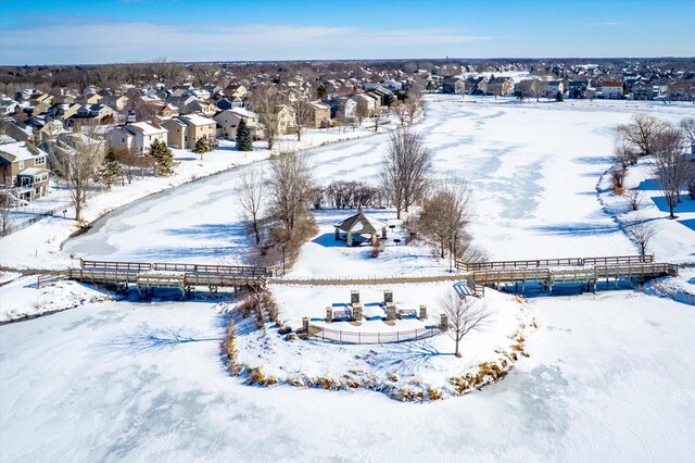 snowy aerial view with a residential view