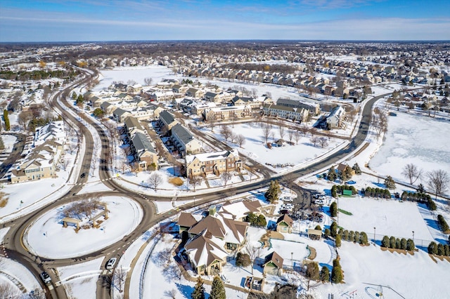 snowy aerial view with a residential view