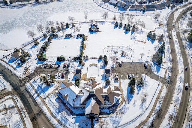 snowy aerial view featuring a residential view