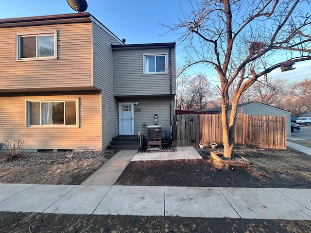 view of front of house with fence