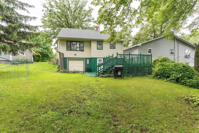 back of property featuring a garage, a lawn, a chimney, stairway, and a wooden deck