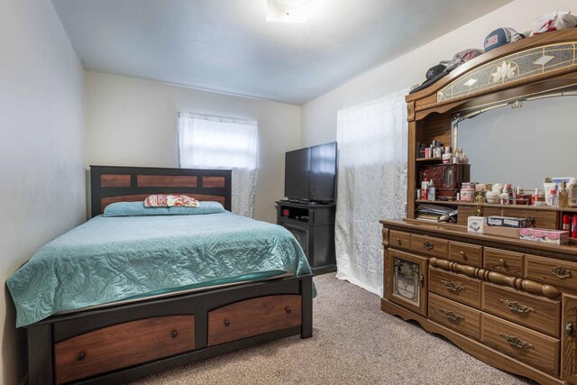 bedroom with light carpet