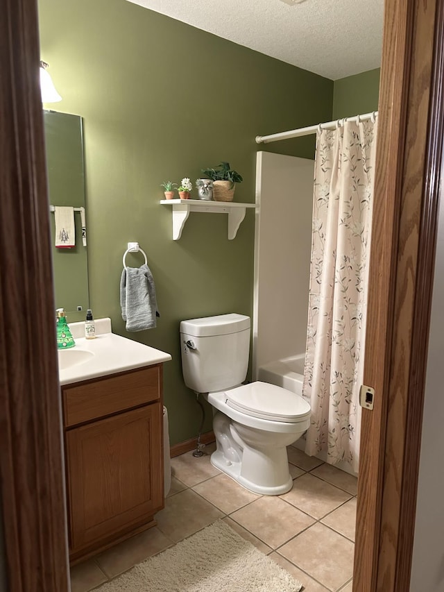 full bathroom with shower / tub combo with curtain, toilet, a textured ceiling, vanity, and tile patterned floors