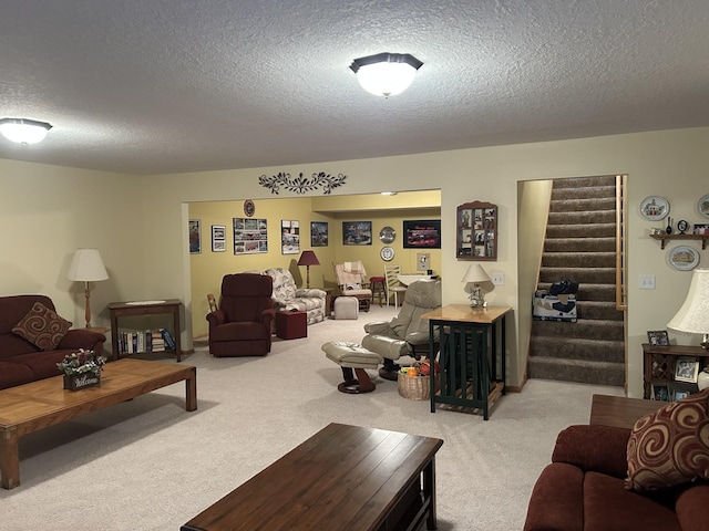 living room featuring stairs, a textured ceiling, and light carpet