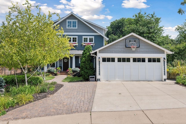 craftsman-style home featuring an outdoor structure, concrete driveway, and an attached garage