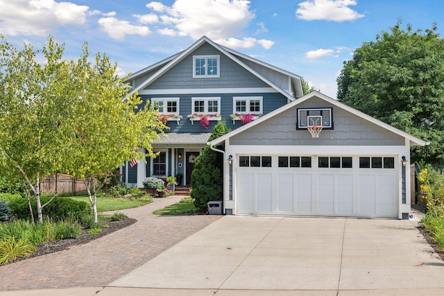 craftsman inspired home with driveway and covered porch