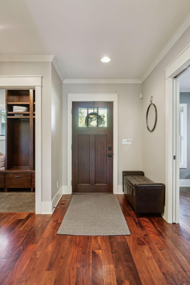 entrance foyer featuring baseboards, recessed lighting, ornamental molding, and wood finished floors