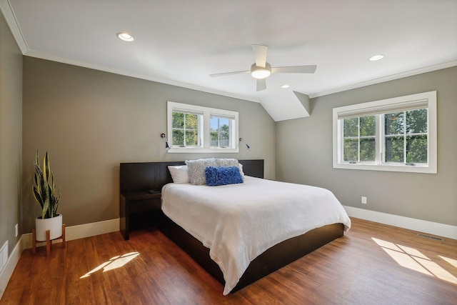 bedroom featuring visible vents, multiple windows, and crown molding