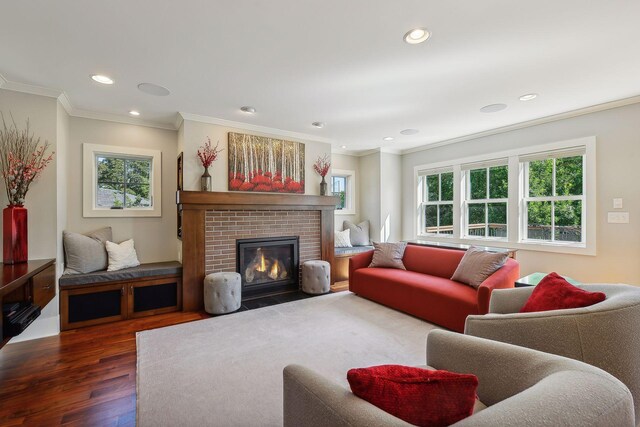 4015 Wood End Dr, Edina, MN 55424 - living area with wood finished floors, ornamental molding, a fireplace, and recessed lighting
