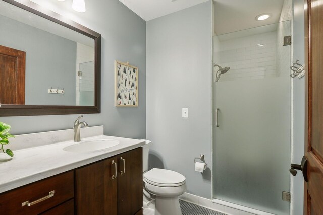 4015 Wood End Dr, Edina, MN 55424 - full bathroom with vanity, a stall shower, toilet, recessed lighting, and tile patterned floors
