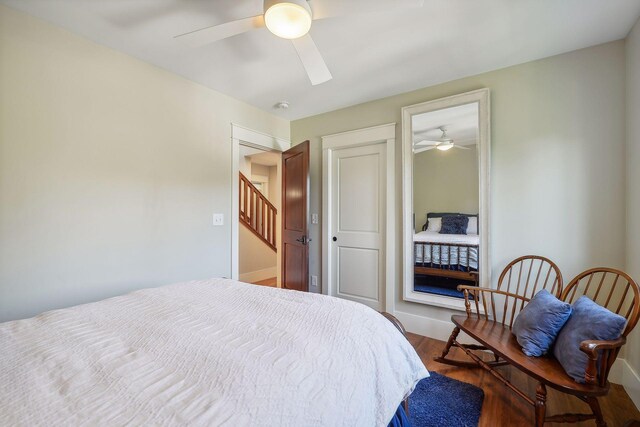 4015 Wood End Dr, Edina, MN 55424 - bedroom featuring a closet, wood finished floors, a ceiling fan, and baseboards