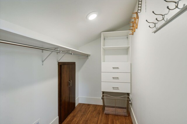 4015 Wood End Dr, Edina, MN 55424 - walk in closet featuring dark wood-style floors and vaulted ceiling