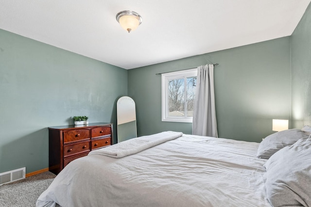 bedroom featuring visible vents, baseboards, and carpet flooring