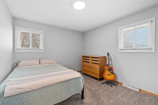 bedroom with visible vents, baseboards, and carpet flooring