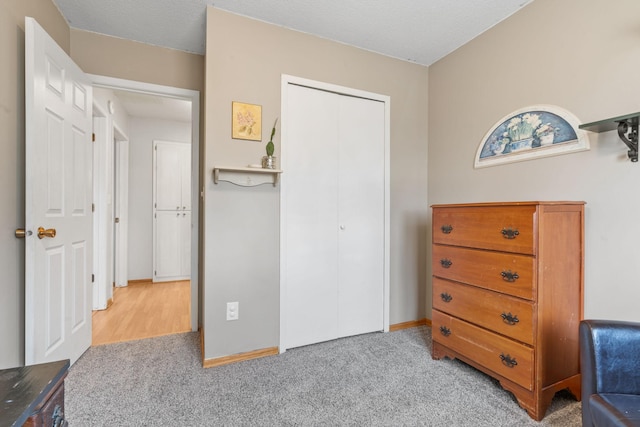 interior space with a closet and baseboards