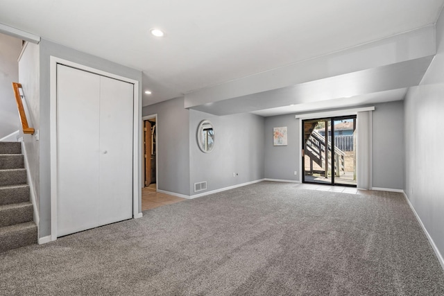 interior space featuring visible vents, baseboards, stairs, carpet floors, and recessed lighting