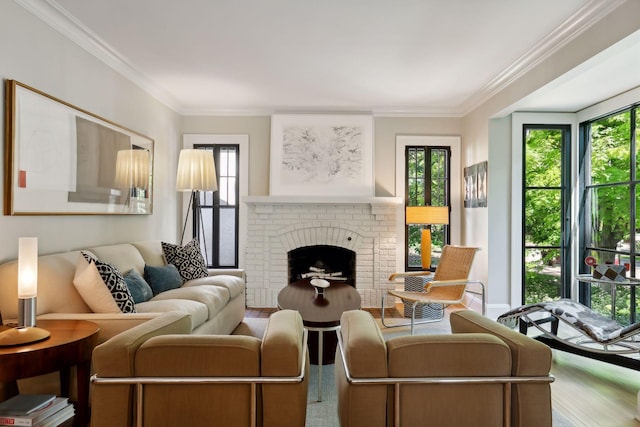 living area with a brick fireplace and crown molding