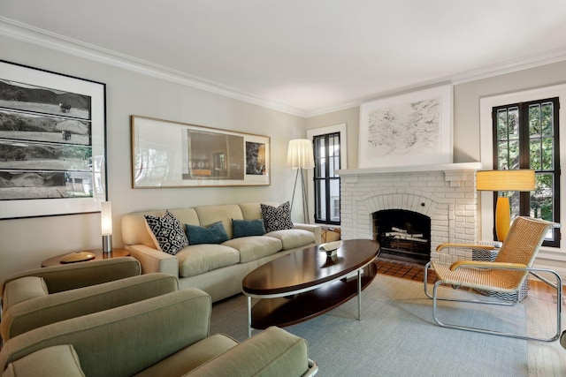 living room with a brick fireplace and crown molding