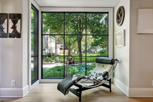 sitting room with wood finished floors and baseboards