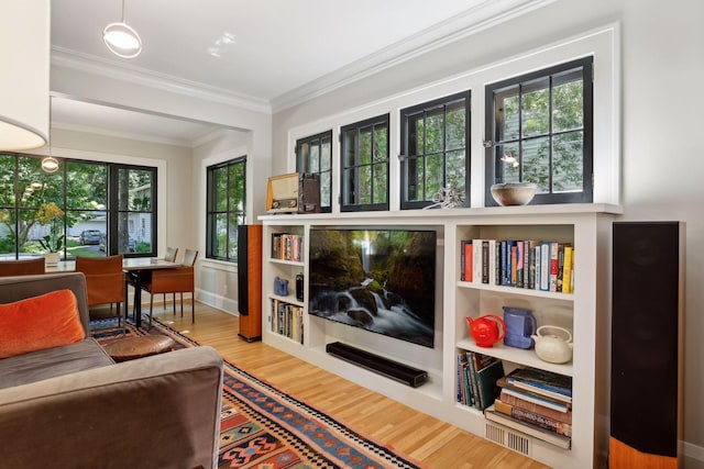 living room featuring wood finished floors and ornamental molding