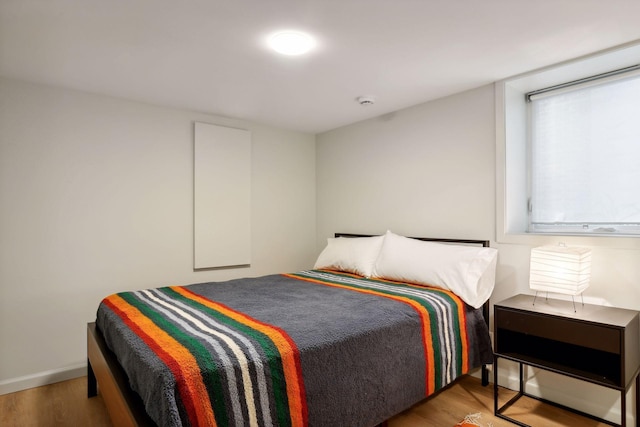 bedroom with wood finished floors