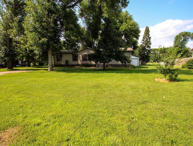 view of yard featuring an attached garage