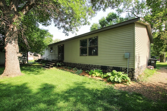 view of property exterior featuring a yard