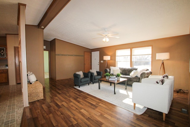 living area featuring lofted ceiling, ceiling fan, and wood finished floors