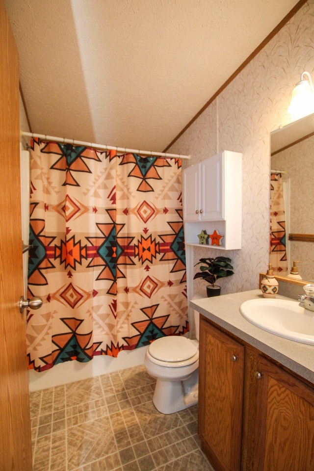 full bath featuring a textured ceiling, toilet, vanity, ornamental molding, and wallpapered walls