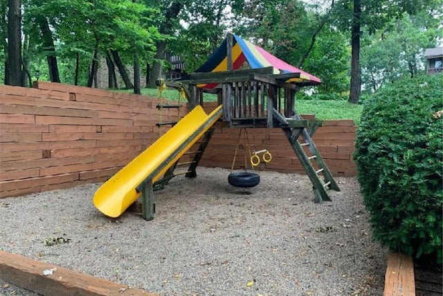 view of jungle gym with fence