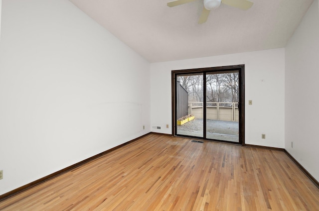 unfurnished room featuring a ceiling fan, visible vents, baseboards, lofted ceiling, and light wood-style floors